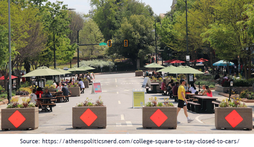 View of College Square on the blocked off section of College Avenue, looking toward the Arch at the University of Georgia in Athens GA. Police make many DUI arrests in this area of concentrated bars and restaurants.