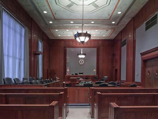 A courtroom with a few chairs