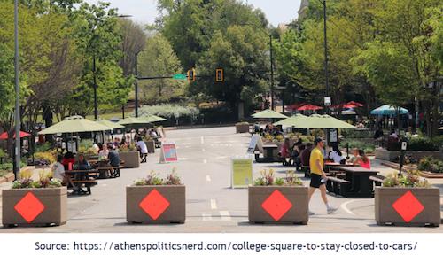 View of College Square on the blocked off section of College Avenue, looking toward the Arch at the University of Georgia in Athens GA. Police make many DUI arrests in this area of concentrated bars and restaurants.